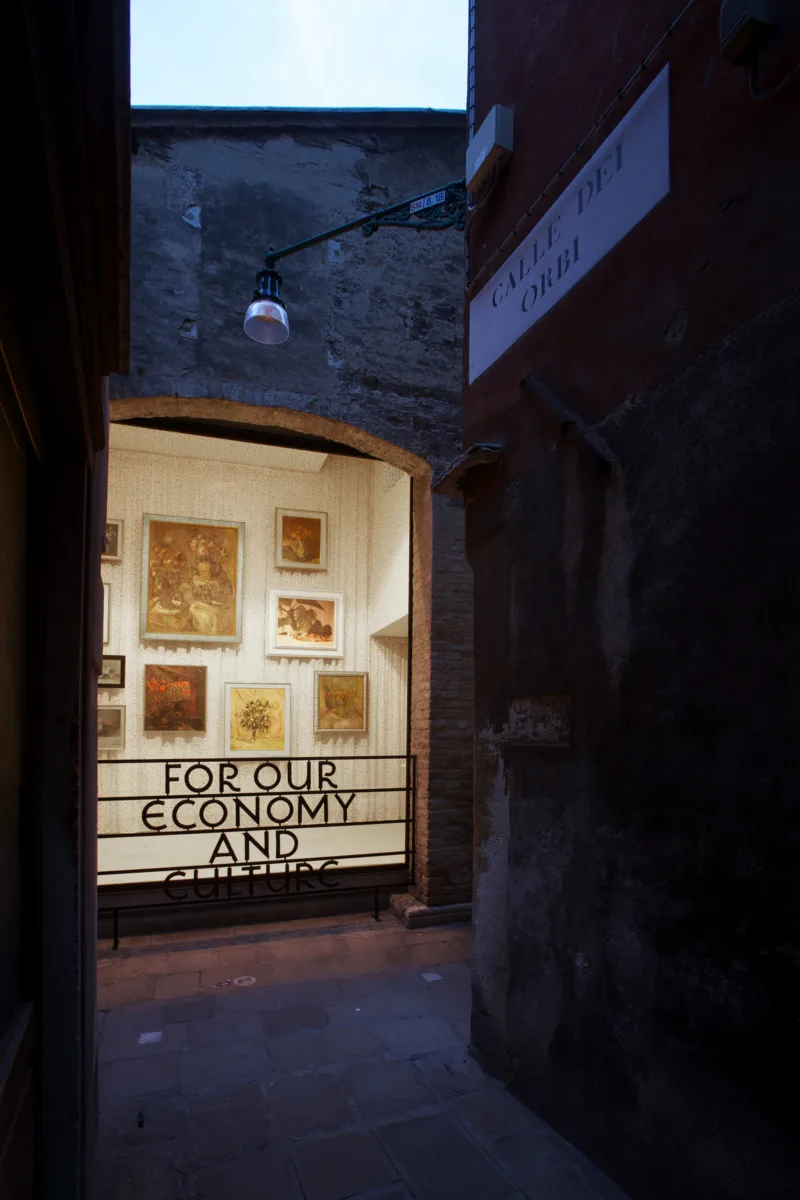 Installation view: iron grate on window, still life paintings from the collection of the National Assembly of Slovenia, For Our Economy and Culture, Pavilion of Slovenia