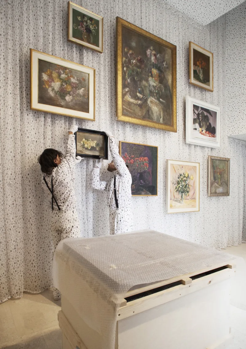 Installation view with performance We knew it would be hard to put anything on these walls, hanging of the painting by Ivana Kobilca (Rožeteje, sine anno), For Our Economy and Culture, Pavilion of Slovenia, Venice Biennial